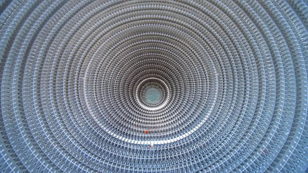 A circular pattern of metal pipes in the air.