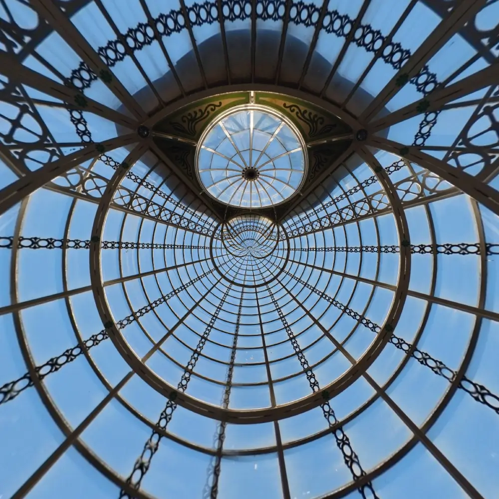 A large glass dome with a clock in the center.