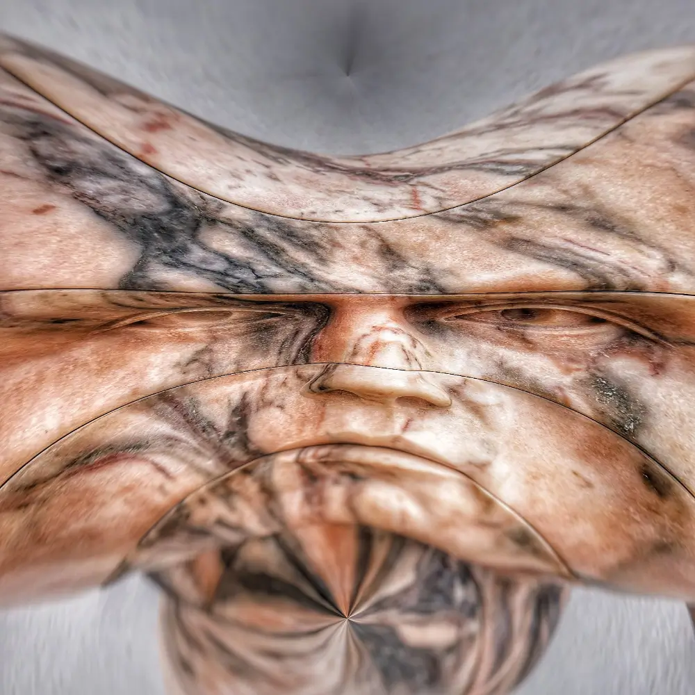 A person with their hands over his face