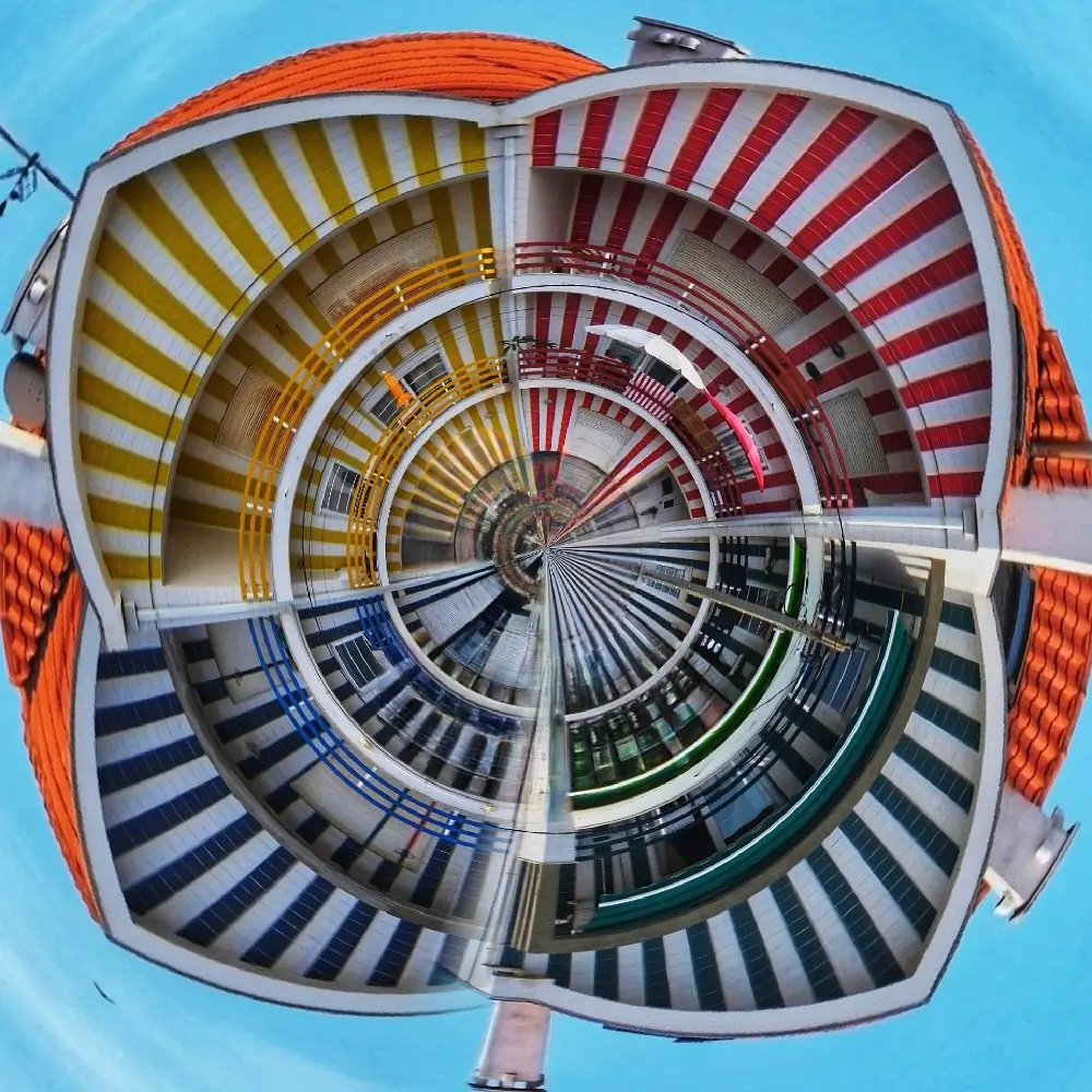 A colorful ferris wheel with many different colors.