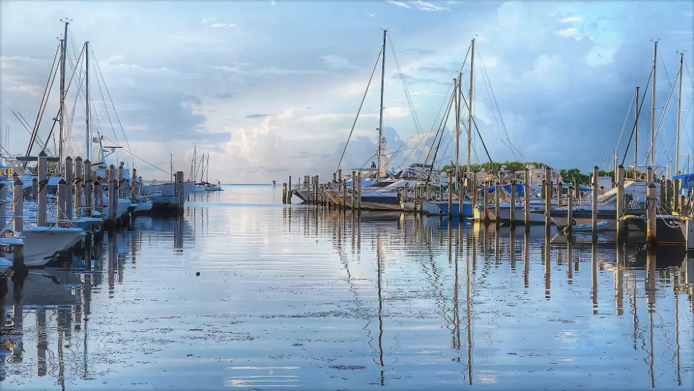 A painting of boats docked in the water