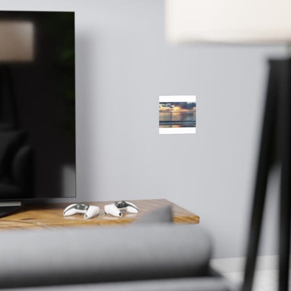 A tv sitting on top of a wooden table.