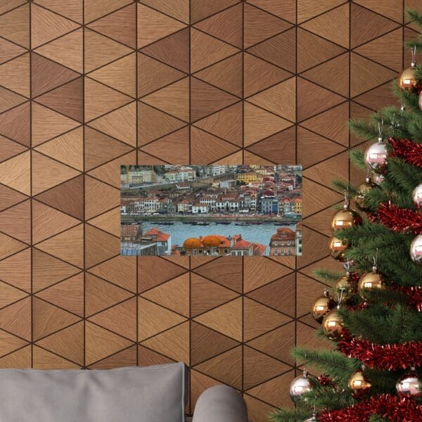 A christmas tree and couch in front of a wall with triangles.