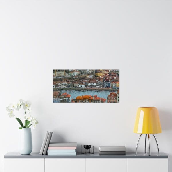 A painting of a city with water and trees