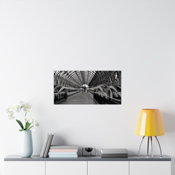 A black and white photo of a room with a yellow lamp