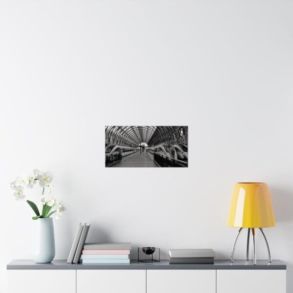 A black and white photo of flowers on the wall