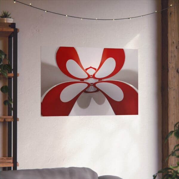 A red and white butterfly hanging on the wall