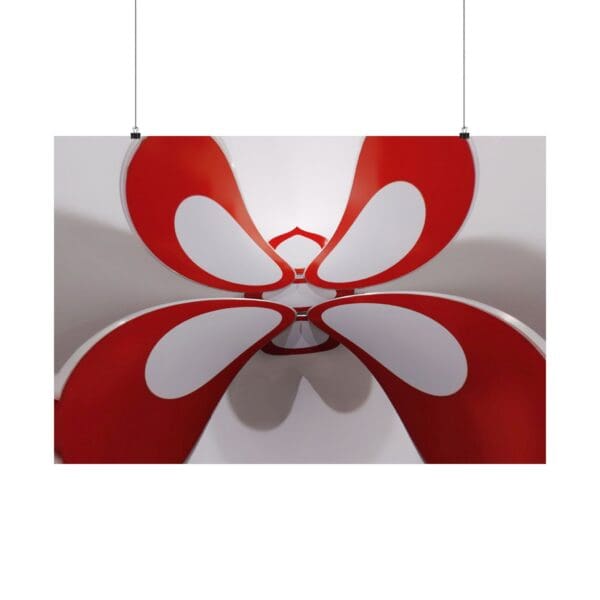 A red and white butterfly hanging from the ceiling.