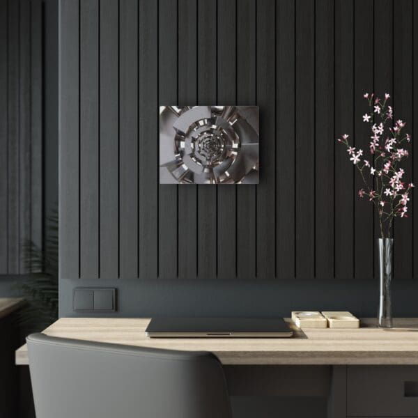 A black wall with a vase of flowers on the table.