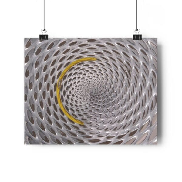 A spiral of metal with yellow and white lines.