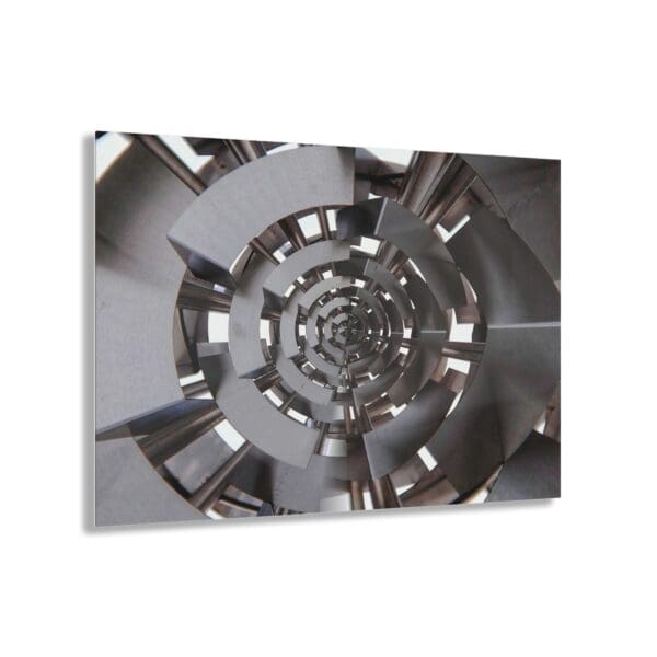 A silver spiral picture with the image of a clock.