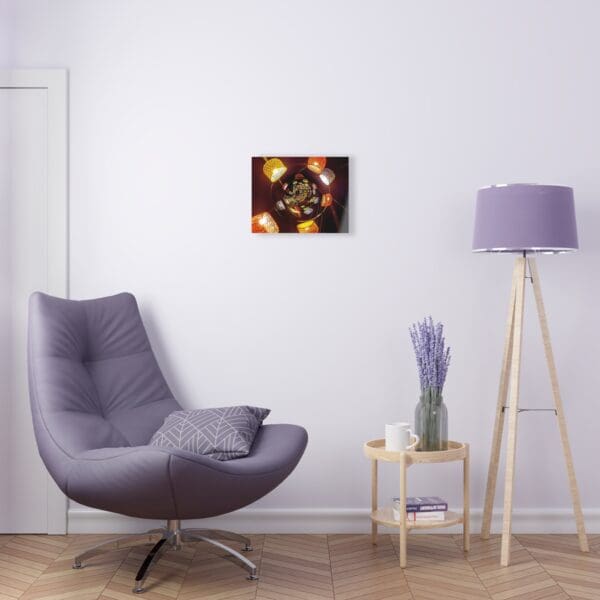 A chair and lamp in a room with a painting on the wall.