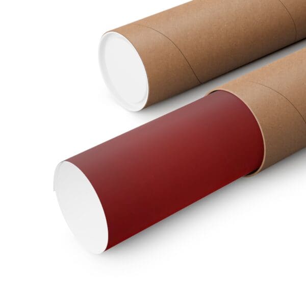 A close up of two cardboard tubes with red paper