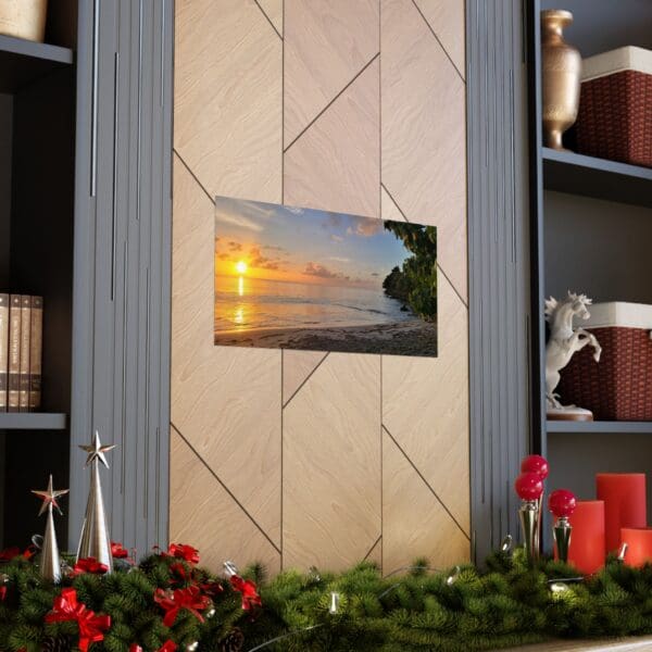 A picture of the sunset on the wall above the fireplace.