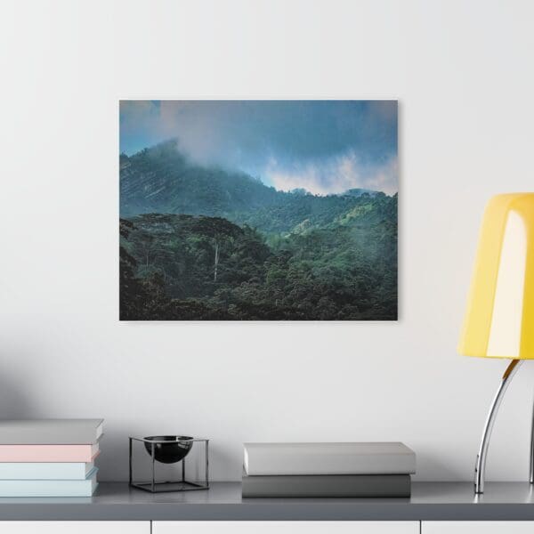 A painting of mountains with a sky filled with clouds.