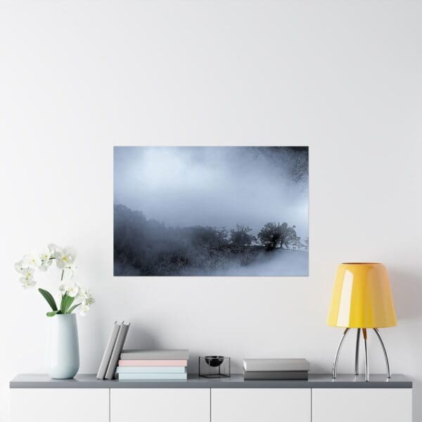 A white wall with some flowers and a table