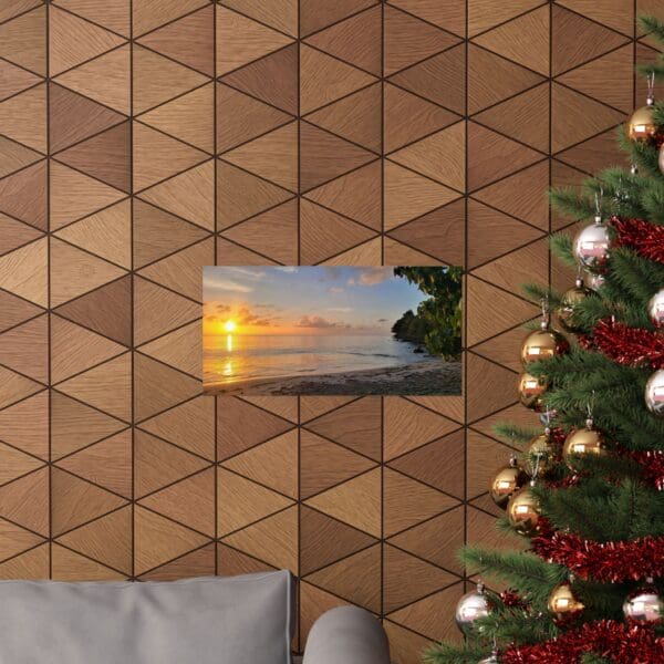 A christmas tree and couch in front of a wall with triangles.