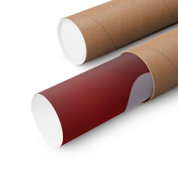 A close up of two cardboard tubes with red paint on them