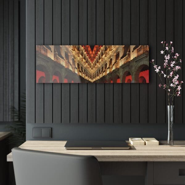 A black wall with a vase and flowers on the table.