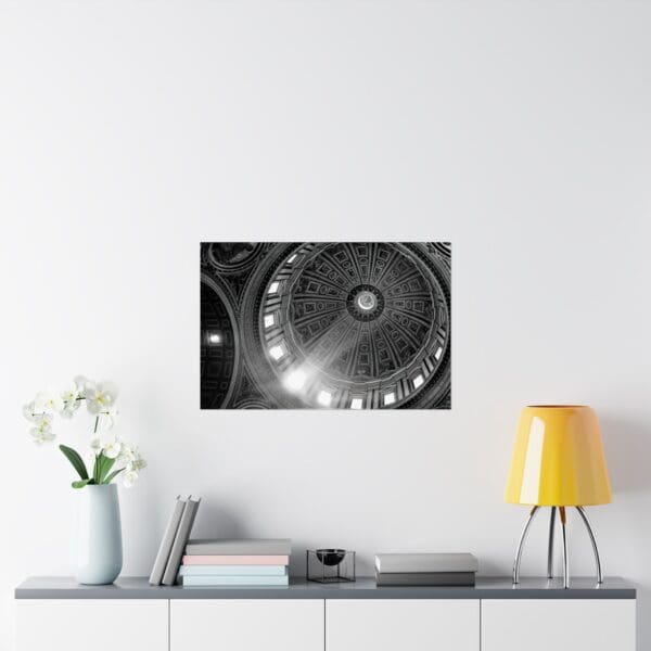 A black and white photo of a clock in the middle of a room.