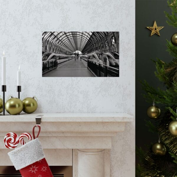 A fireplace with a christmas stocking and a picture of a tree.