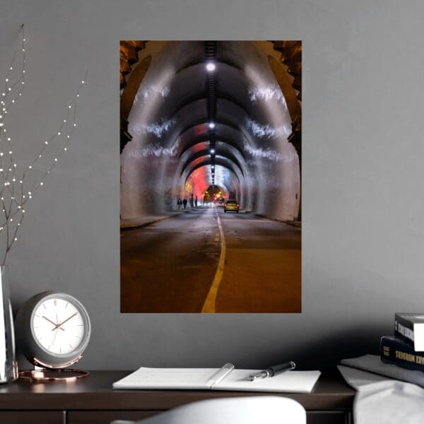 A picture of an empty tunnel with the lights on.