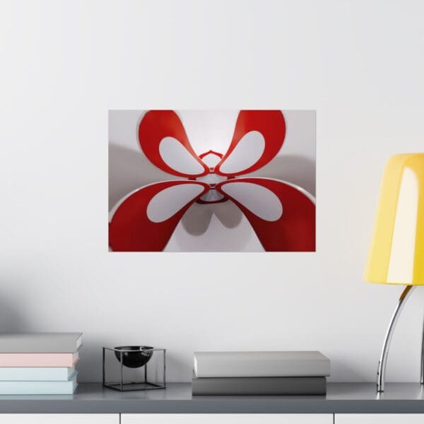 A red and white butterfly on the wall