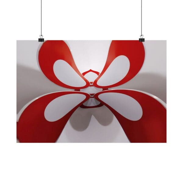 A red and white butterfly hanging from a ceiling.