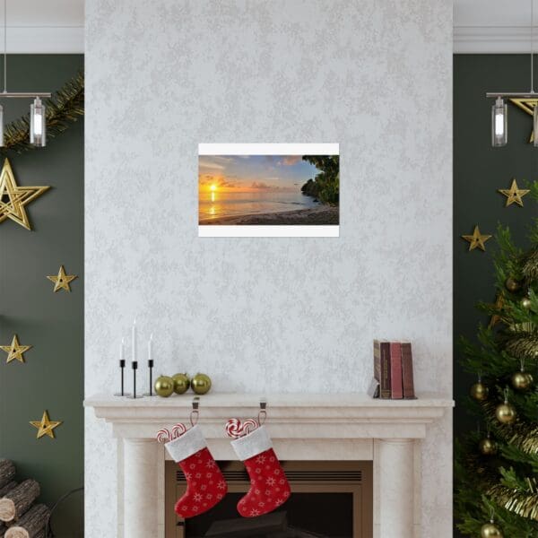 A fireplace with christmas stockings and a picture of the sun setting.