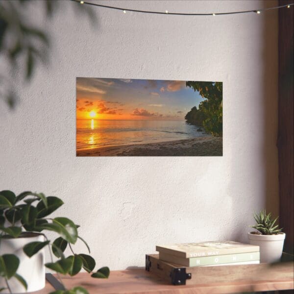 A painting of the sun setting over the ocean.