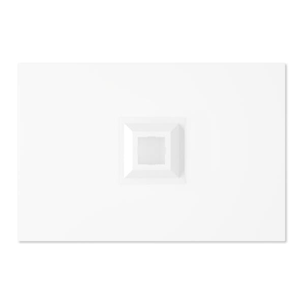 A white plate with an empty square on it.