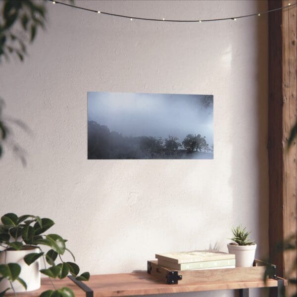 A white wall with a painting of trees in the middle.