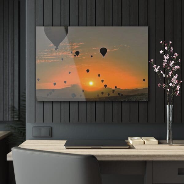 A television screen with balloons flying in the background.