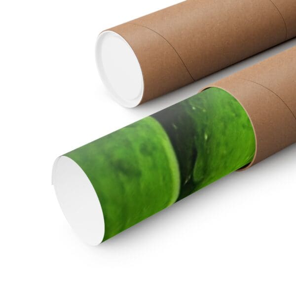 A close up of two tubes with green paint on them