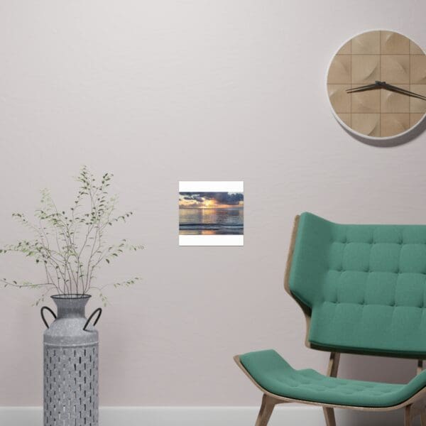 A green chair and clock in the corner of a room.